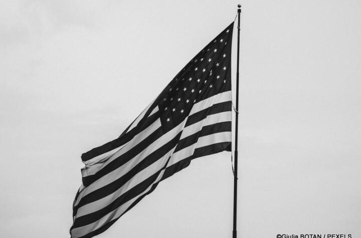Black and white U.S. flag representing the context of Alex Pretti killed by ICE