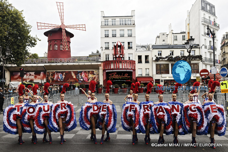 Moulin Rouge dancers display a giant "Tour de France" formation in front of the famous Paris cabaret before the race finale.